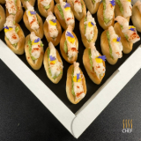Meal card cover for: Vodka flamed Giant Prawns on mini Zopfs with Chili Mango & Avocado Chutney