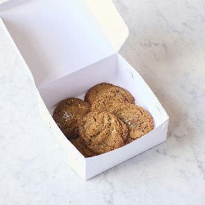 Meal card cover for: Box of flourless white chocolate and macadamia nut cookies