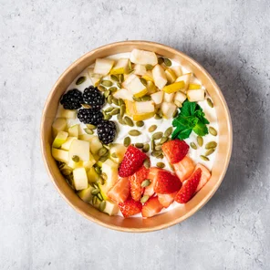 Meal card cover for: High protein Greek yogurt with blackberries, strawberries, apple, pear, pumpkin seeds and garnished with mint leaves.