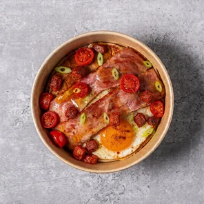 Meal card cover for: Protein Pancakes with a Fried Egg, Turkey Bacon, Cherry Tomatoes, Chorizo, Spring Onion & Maple Syrup.
