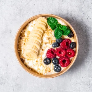 Meal card cover for: High protein Greek yogurt with mixed berries, mixed nuts, banana, honey garnished with mint
