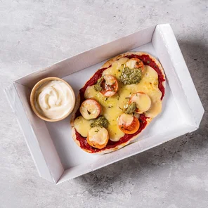 Meal card cover for: Pitta pizza topped with tomatoes, cheese, pesto & herbs with a dip of your choice.