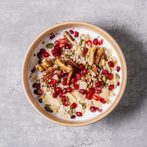 Meal card cover for: High protein Greek yogurt with walnuts, pecans, flaked almonds, mixed nuts, mixed seeds and pomegranate seeds.