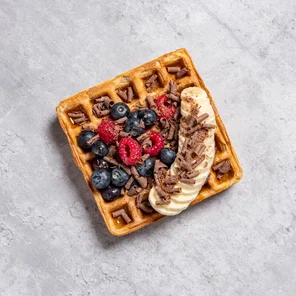 Meal card cover for: High Protein Vegan Waffle with Banana, Mixed Berries, Chocolate Curls & Honey 🍌🫐🍫🍯