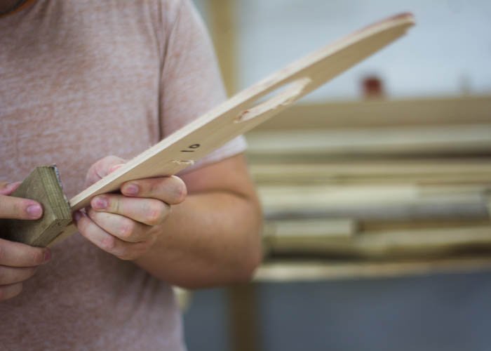 Ian sand a wooden surfboard rib framework