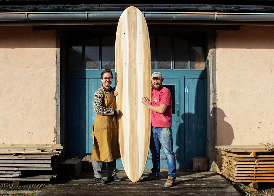 otter workshop wooden surfboard blue doors