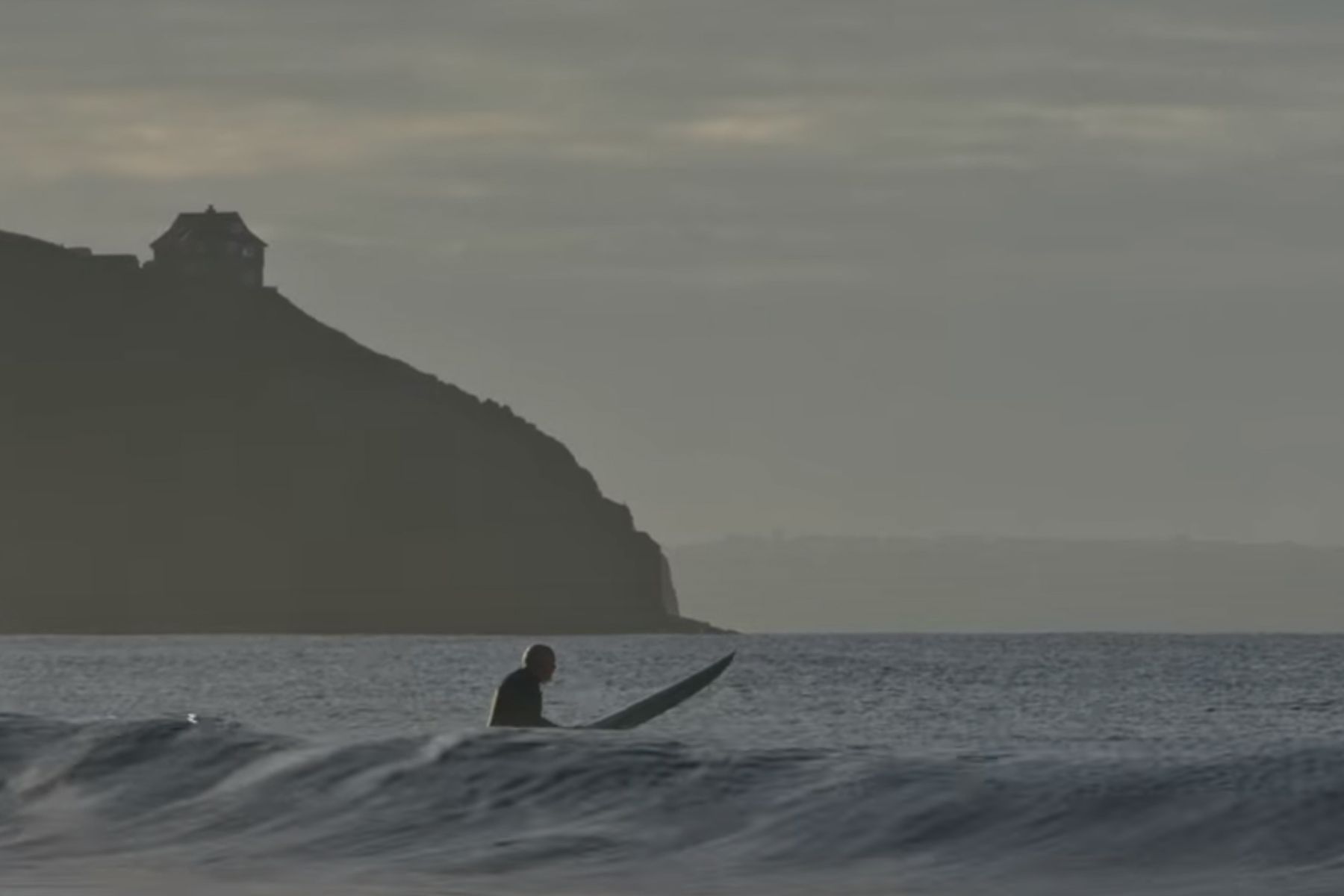 silver surfer film grab surfer sitting in the sea