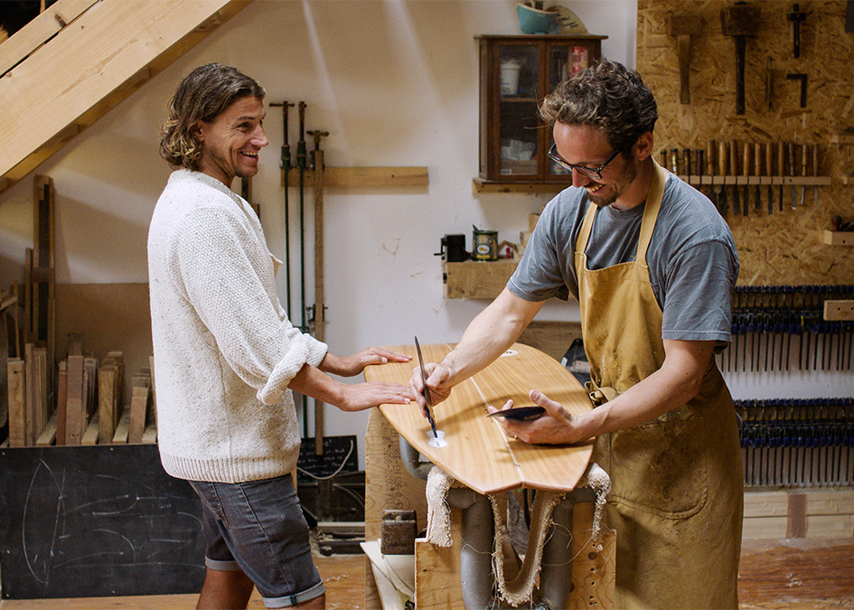 James Otter Alan Stokes in the workshop making a wooden surfboard