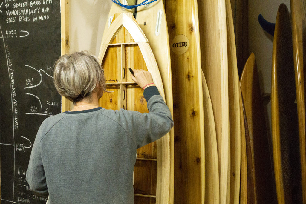 bodhi and James Otter buddy wooden surfboard workshop writing inside her board