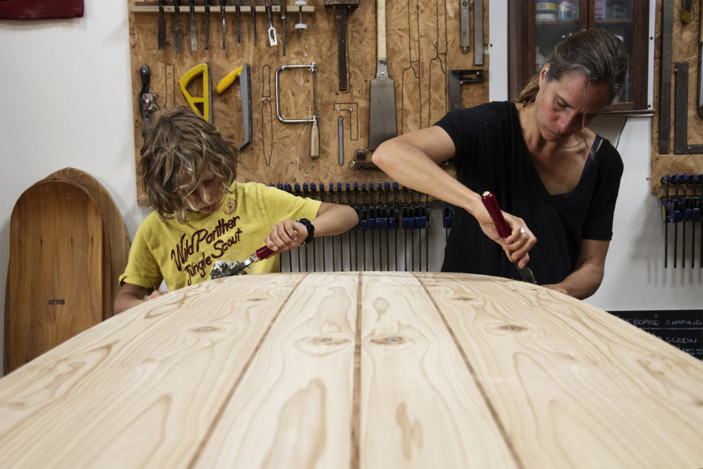 Workshop course for making a wooden paddle board in the otter surfboards workshop mum and son family.