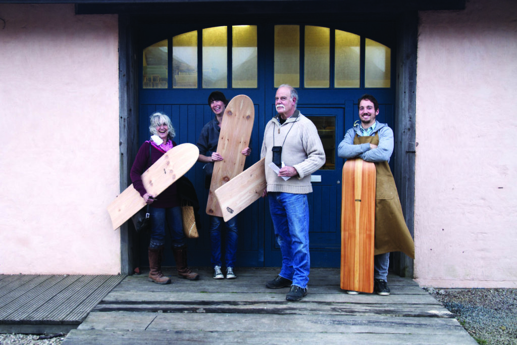 Wooden bellyboard group stood outside the otter surfboards workshop with James