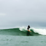 Chris top turns on the Pier. Otter wooden surfboards, Chapel Porth, Cornwall.