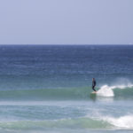 James Otter in trim on his wooden longboard Otter Surfboard Wicket at Porthtowan.