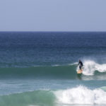 James Otter on his Wicket Wooden surfboard surfing in Cornwall