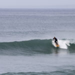 Chris lines up a fun wave at Church Cove, in Cornwall on his Jetty Otter Wooden surfboard.