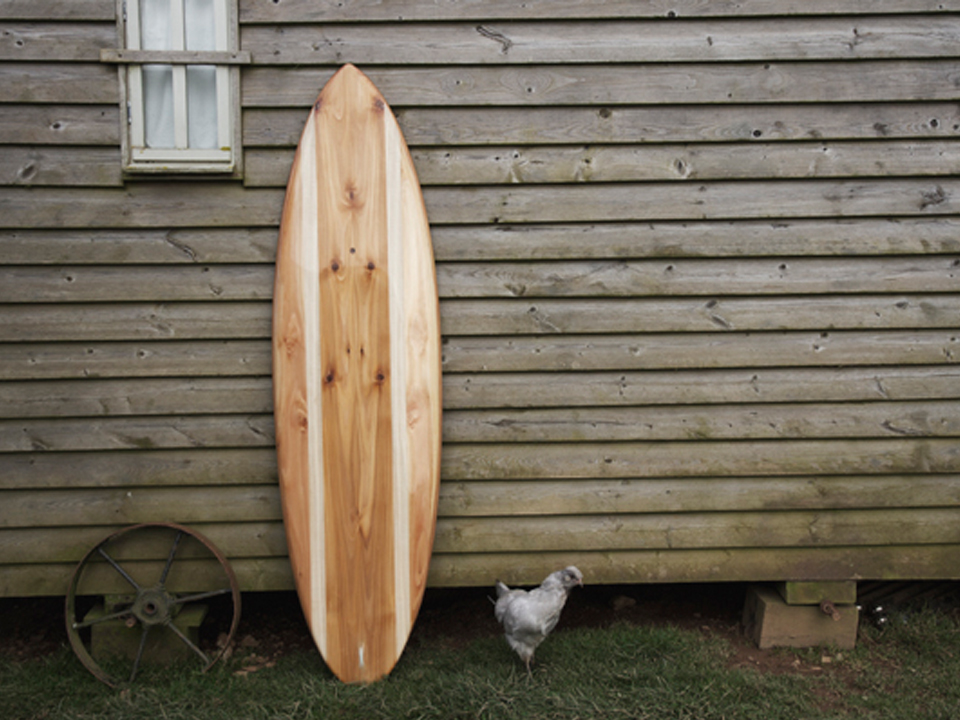 finished wooden surfboard deck otter surfboards workshop cornwall cutter