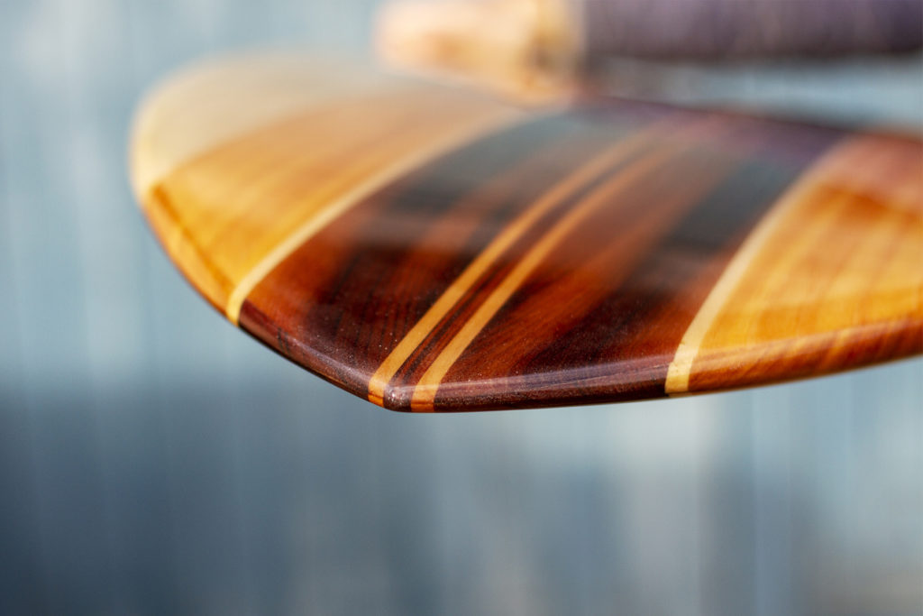 Detail of finished wooden surfboard nose otter surfboards workshop cornwall swift