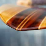 Detail of finished wooden surfboard nose otter surfboards workshop cornwall swift