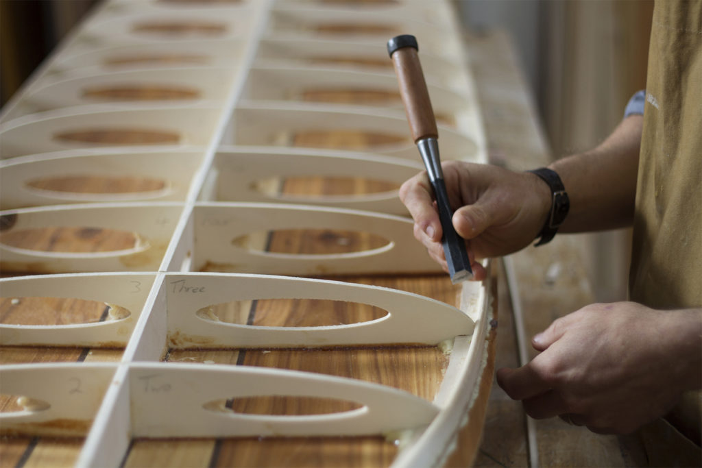 James Otter shaping wooden surfboard hand made handcrafted chisel workshop