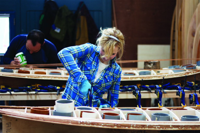 Otter Surfboards wooden surfboard workshop course in Cornwall Kim and Shelby gluing and clamping