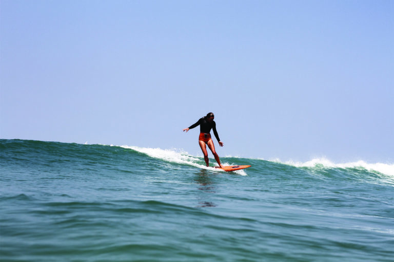 Sarah finding a wave on the otter surfboards Wood Burner Wooden surfboard at Chapel Porth, Cornwall Super stylish