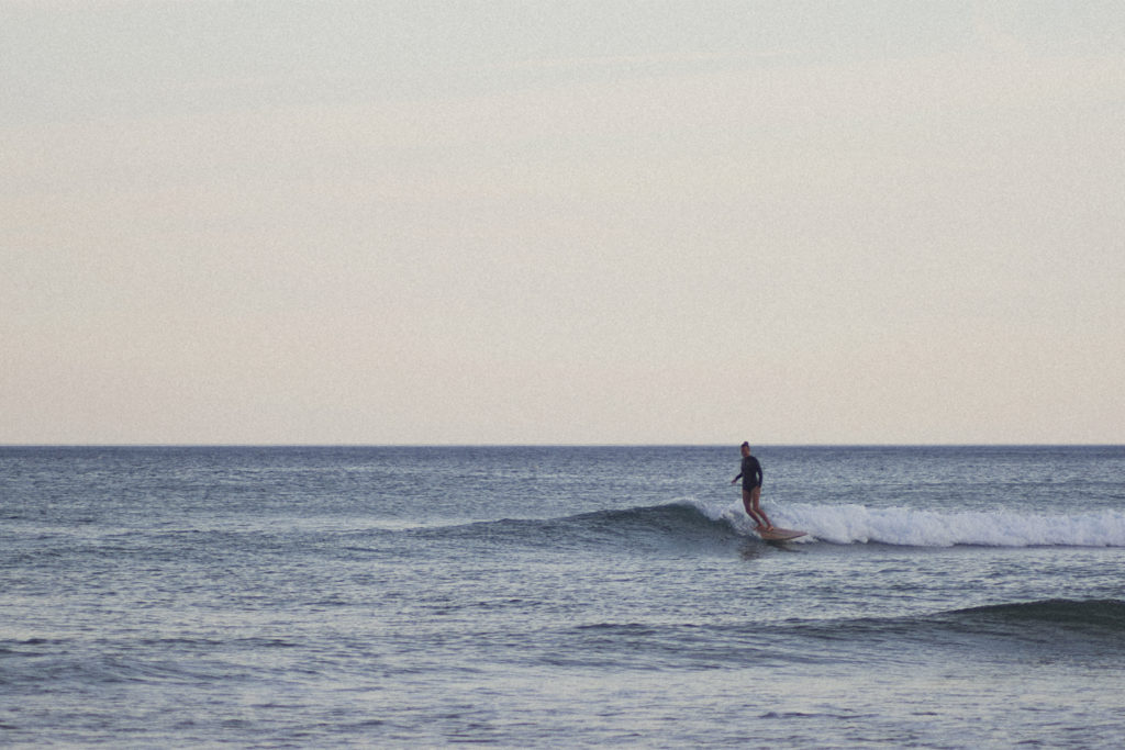 Sarah finding a lonely wave on the otter surfboards Pieces of Eight Wooden surfboard at Chapel Porth, Cornwall