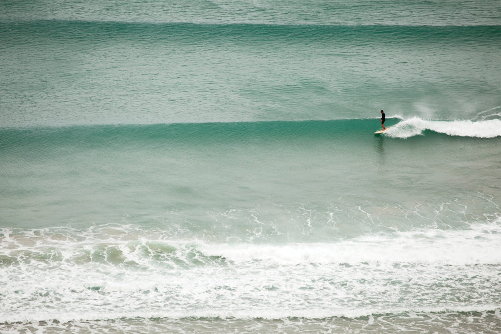 Marcus in trim on the Otter Surfboards Wooden Coaster at Chapel Porth, Cornwall.