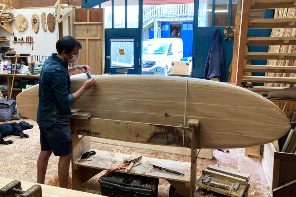Henry Shaping his wooden SUP in the OPtter Workshop