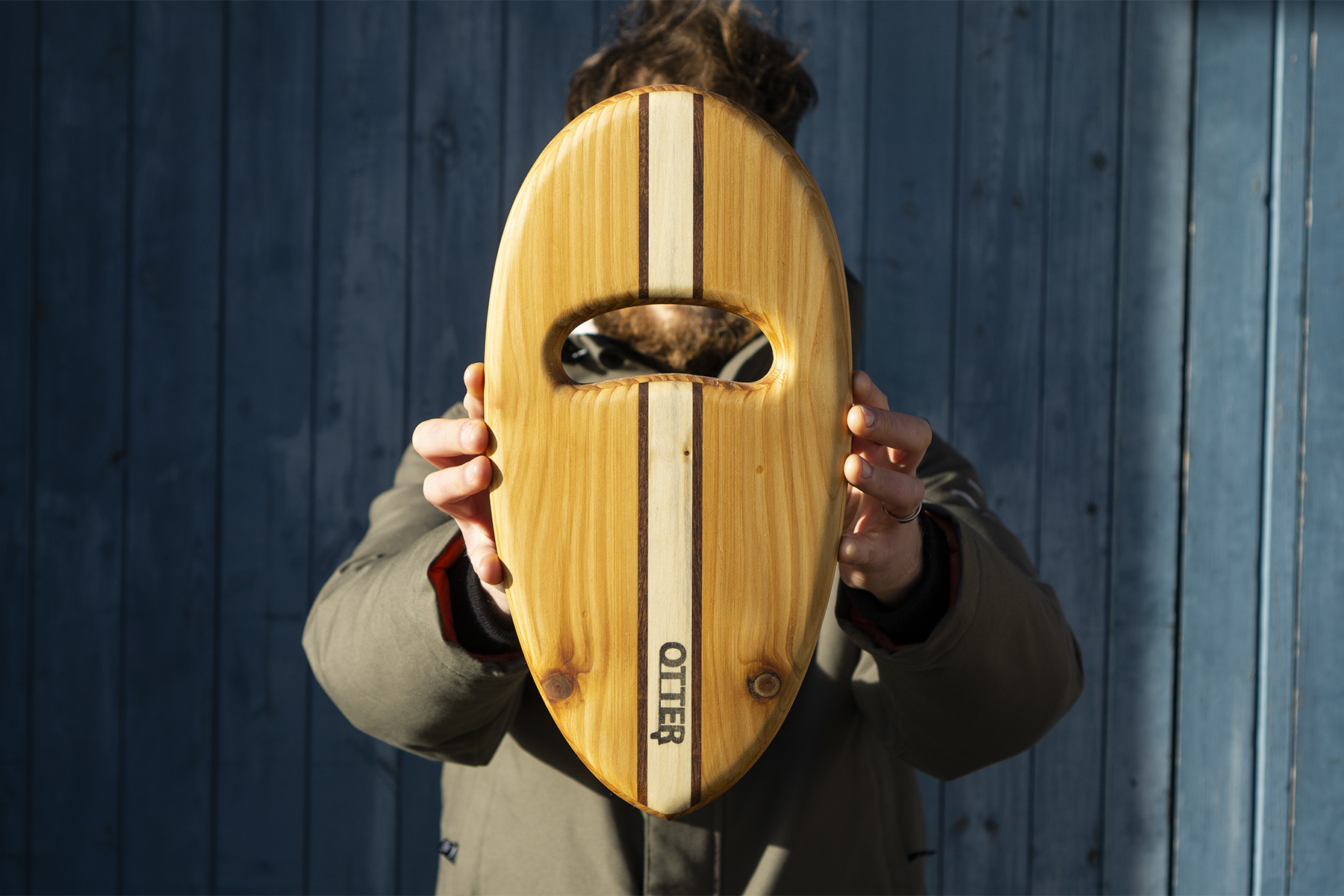 wooden bodysurfing handplane with sandwich layup pebble hand hole