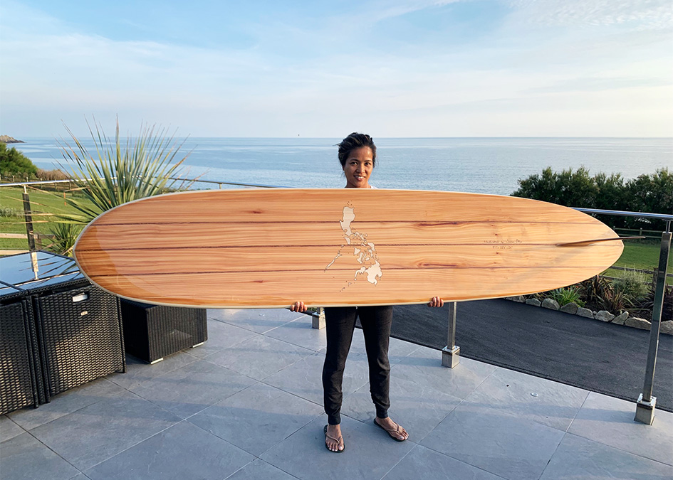 Wooden Longboard Custom Otter Surfboard with Map inlay of Philippines holding her gift