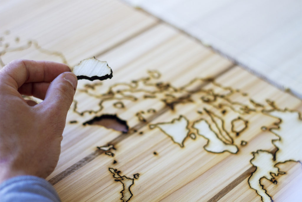 Wooden Longboard Custom Otter Surfboard with Map inlay of Philippines hands close up