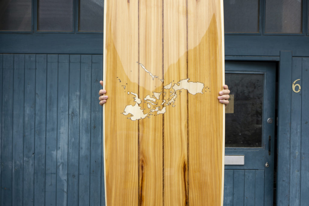 Wooden Longboard Custom Otter Surfboard with Map inlay of Philippines close up of finished board