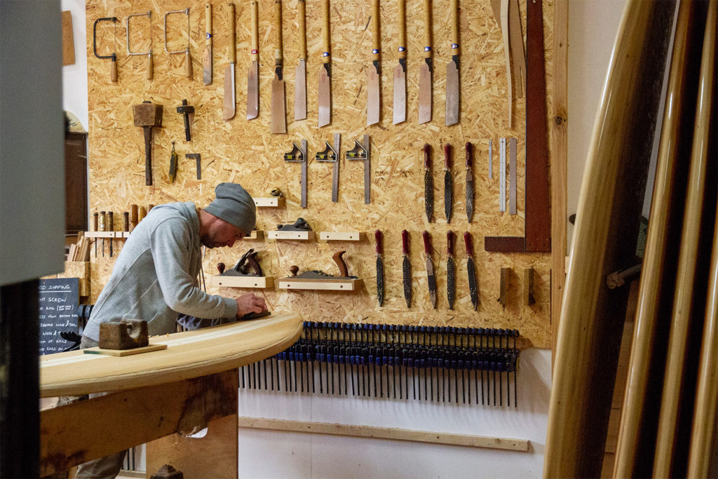 james Otter wooden surfboard workshop course cornwall with jonas with the tool wall