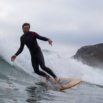 Chris surfing wooden surfboard st agnes Jetty