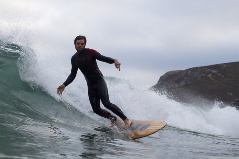Chris surfing wooden surfboard st agnes Jetty