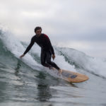 Chris surfing wooden surfboard st agnes Jetty
