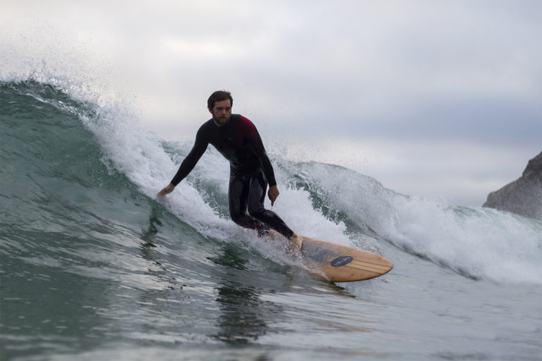 Chris surfing wooden surfboard st agnes Jetty