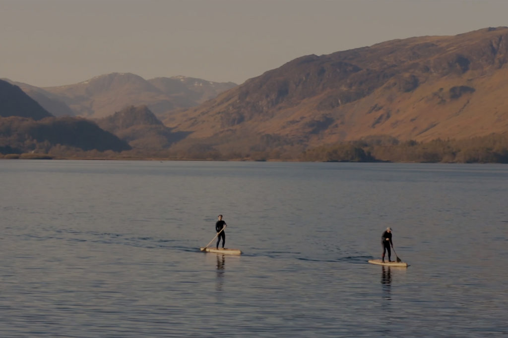Otter Paddleboard in the Lakes with grey overlay