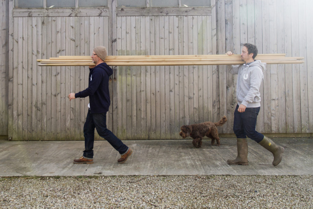 Otter_Surfboards_Hoodie_Lifestyle_plank_carry
