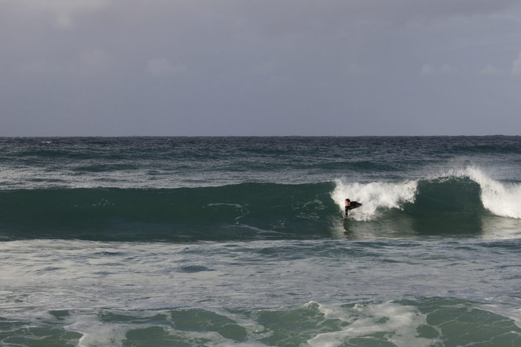 James Otter on his Otter Surfboards wooden handplane at St Ives Porthmeor, Cornwall