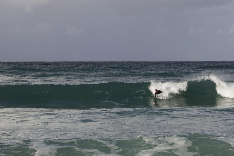 James Otter on his Otter Surfboards wooden handplane at St Ives Porthmeor, Cornwall