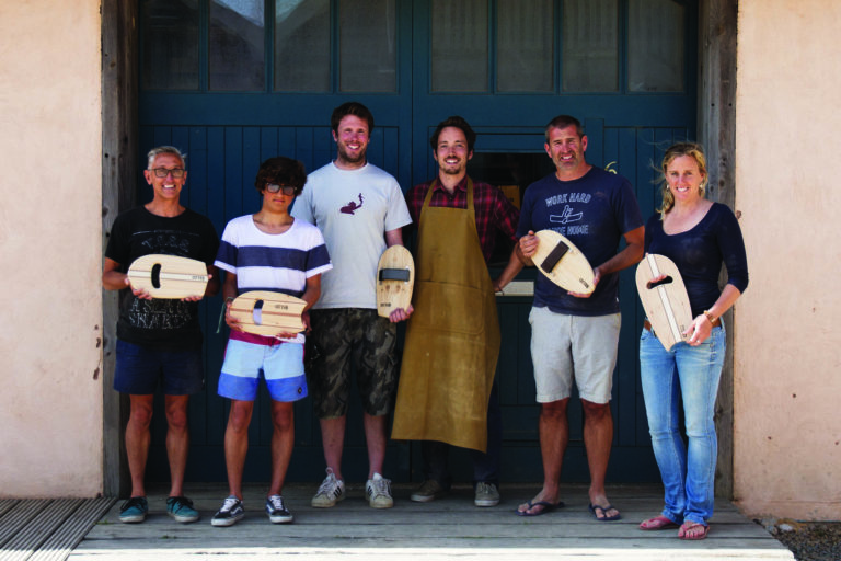 wooden bodysurfing handplane workshop group outside the otter surfboards workshop