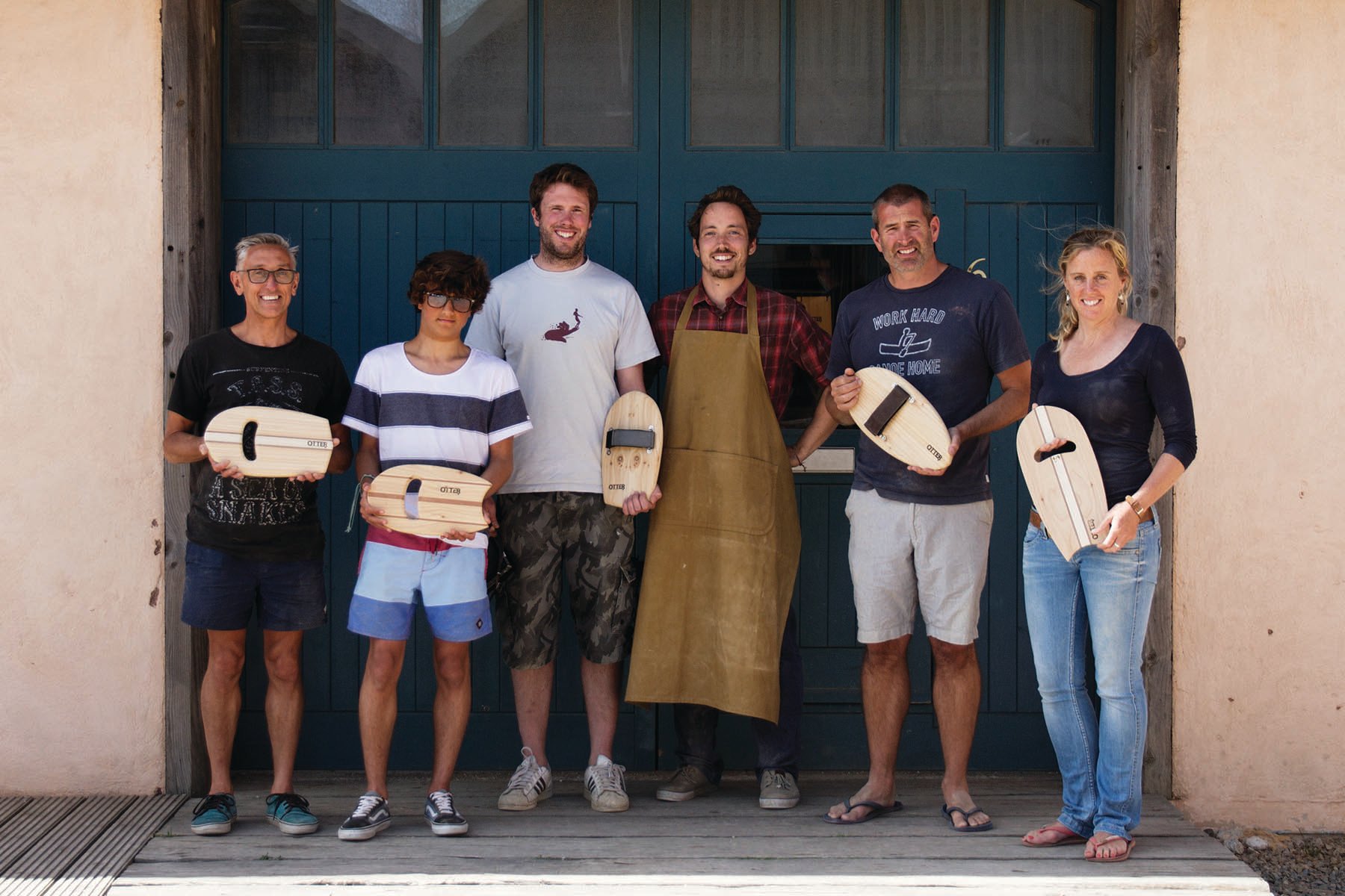 wooden bodysurfing handplane workshop group outside the otter surfboards workshop