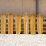 Full Line up of wooden bellyboards in front of the wood stack
