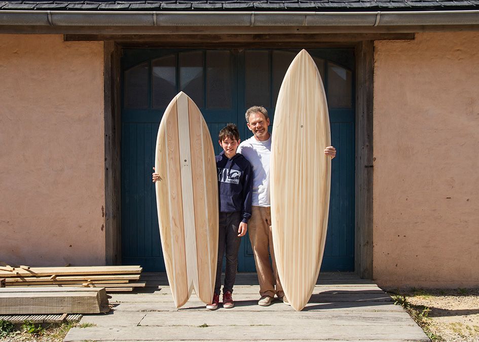otter wooden surfboard workshop blue doors