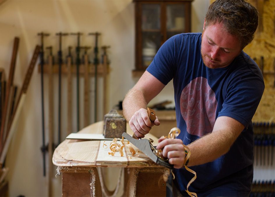 otter wooden surfboard workshop shaping