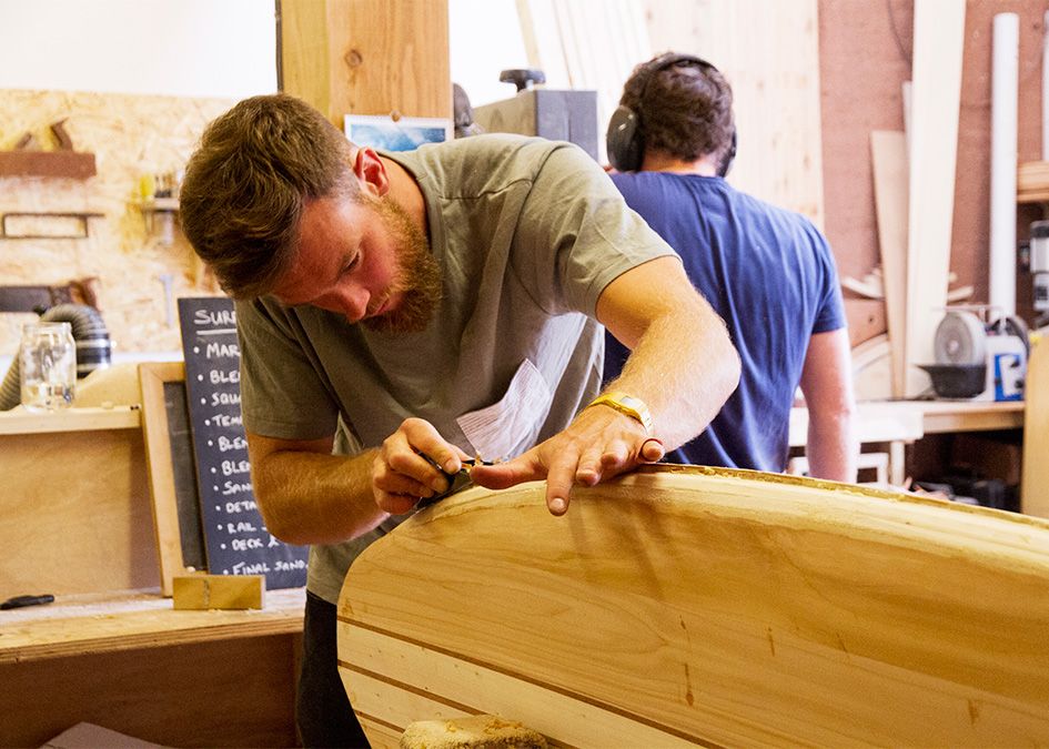otter wooden surfboard workshop shaping