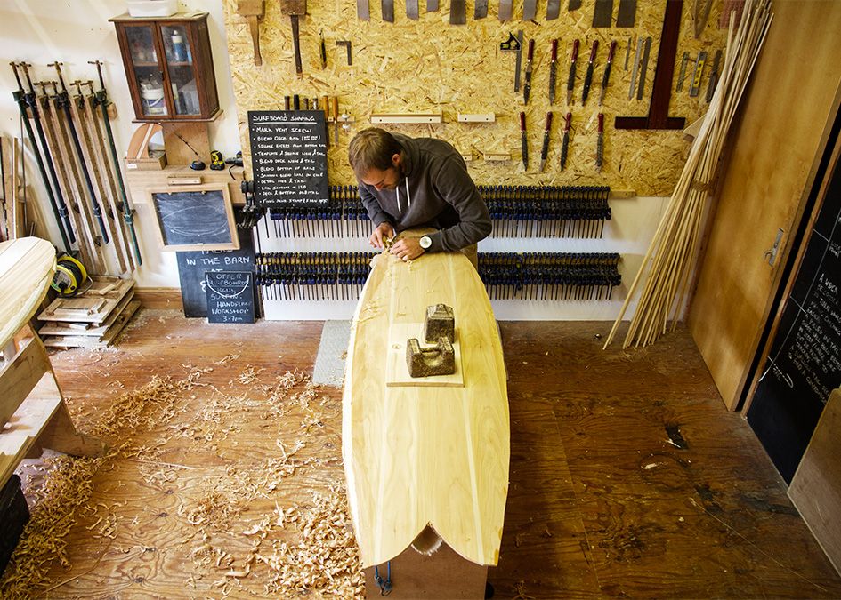 Otter wooden surfboard workshop shaping