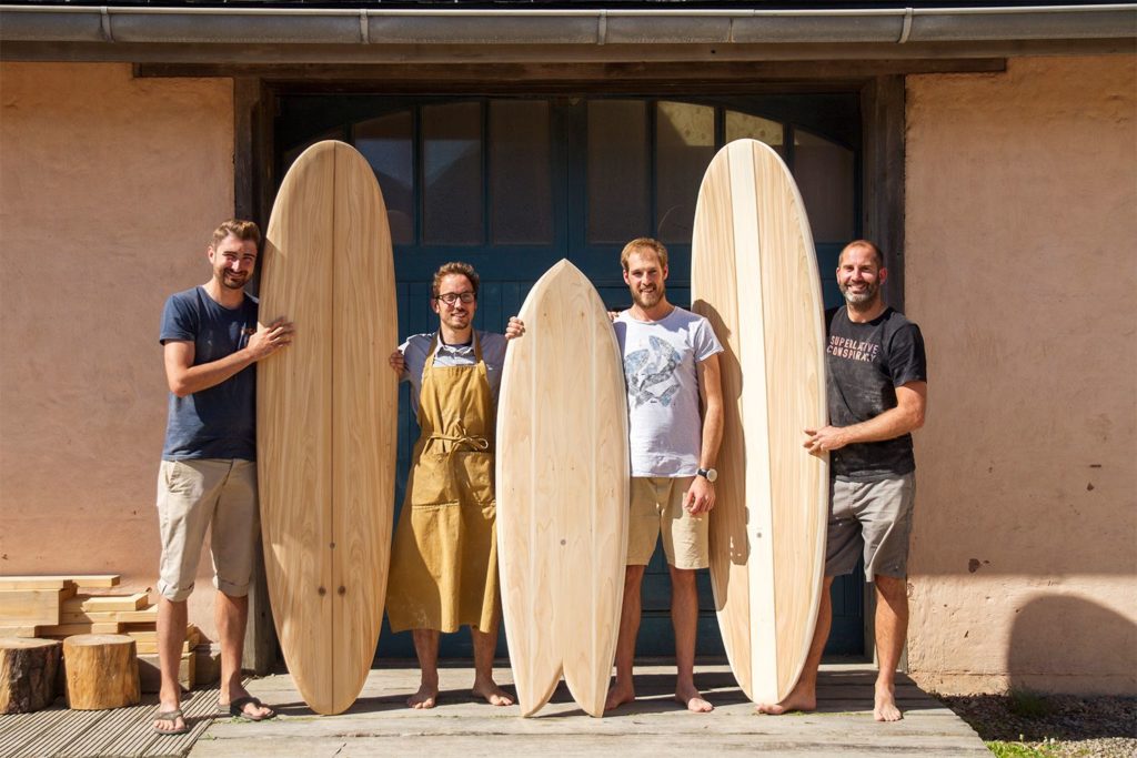 Otter wooden surfboard workshop blue doors