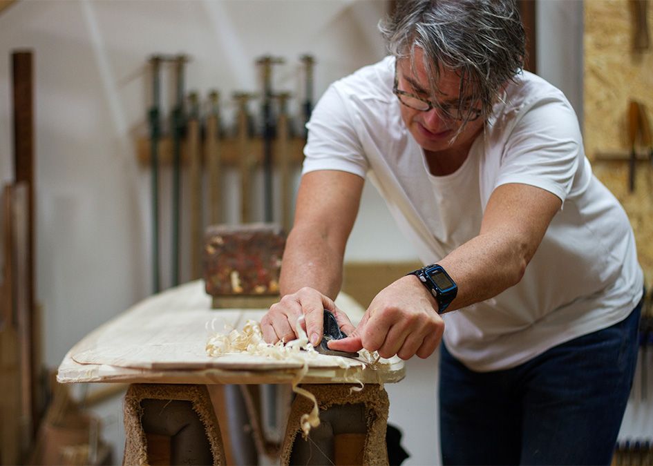 Otter wooden surfboard workshop shaping